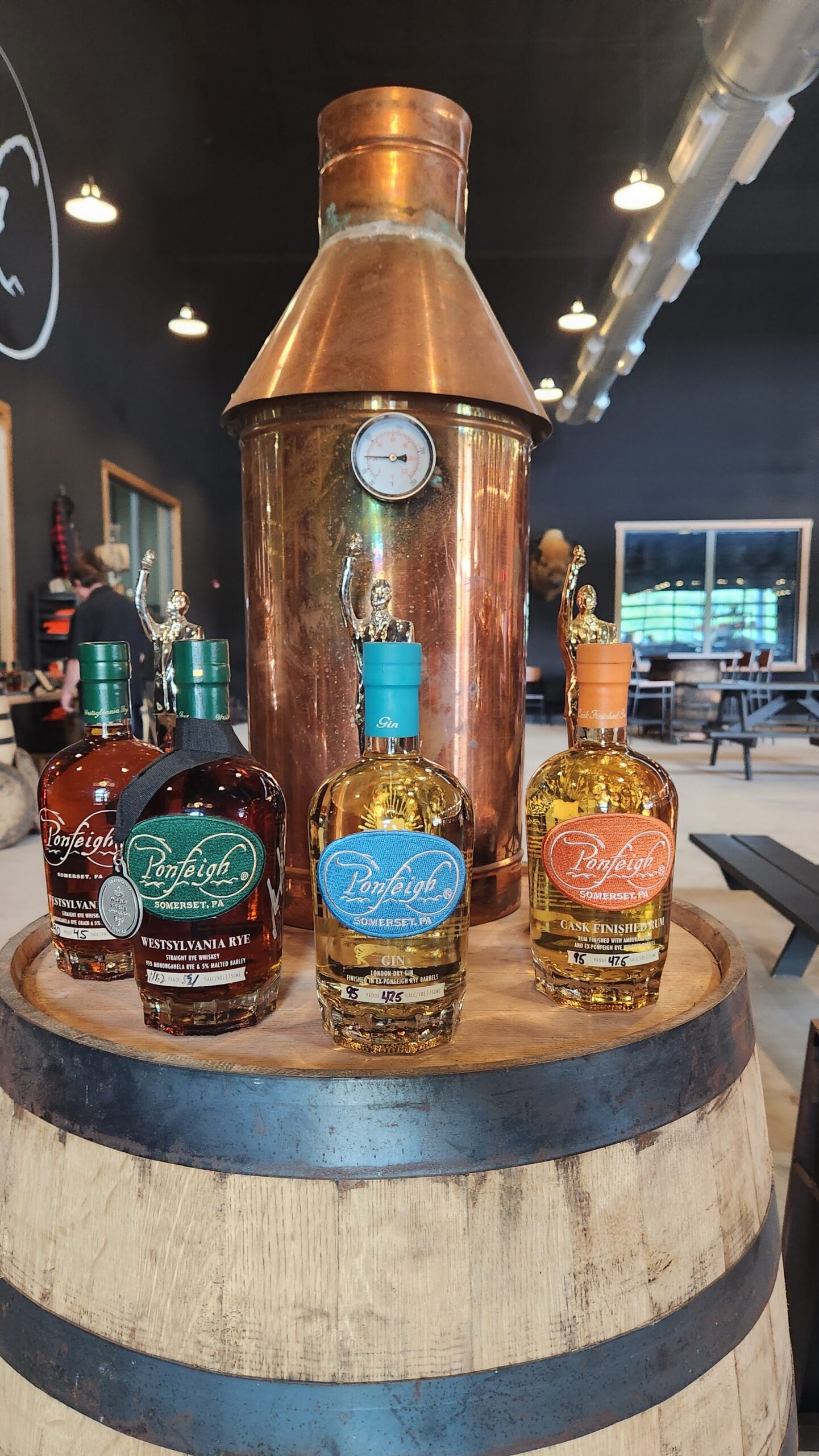 ponfeigh display of four bottles