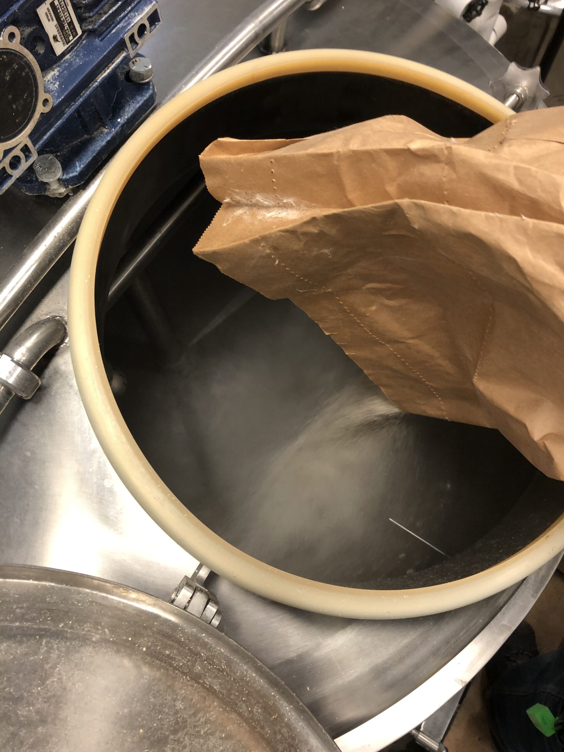 pouring a bag of grain