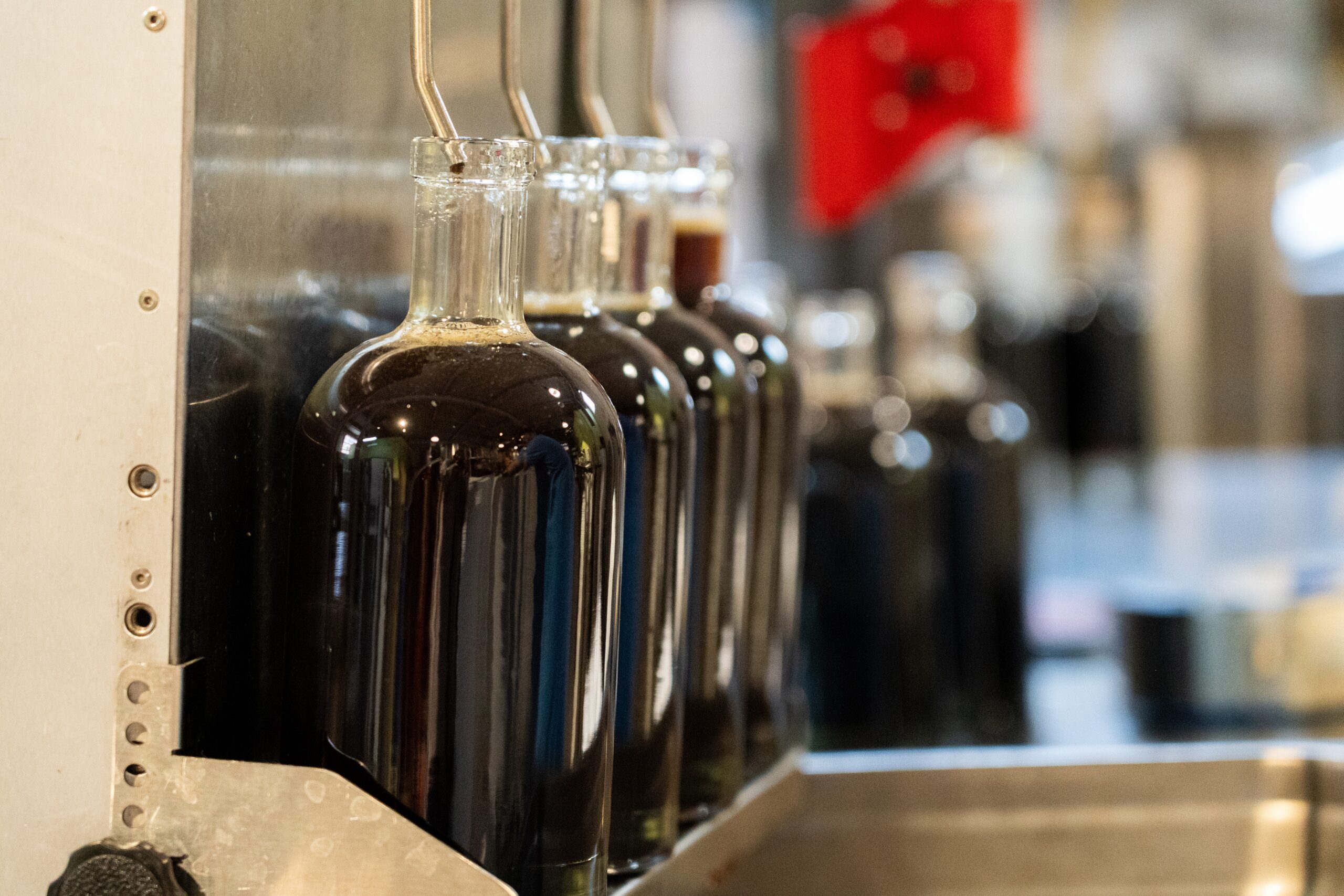 rows of bottles being filled